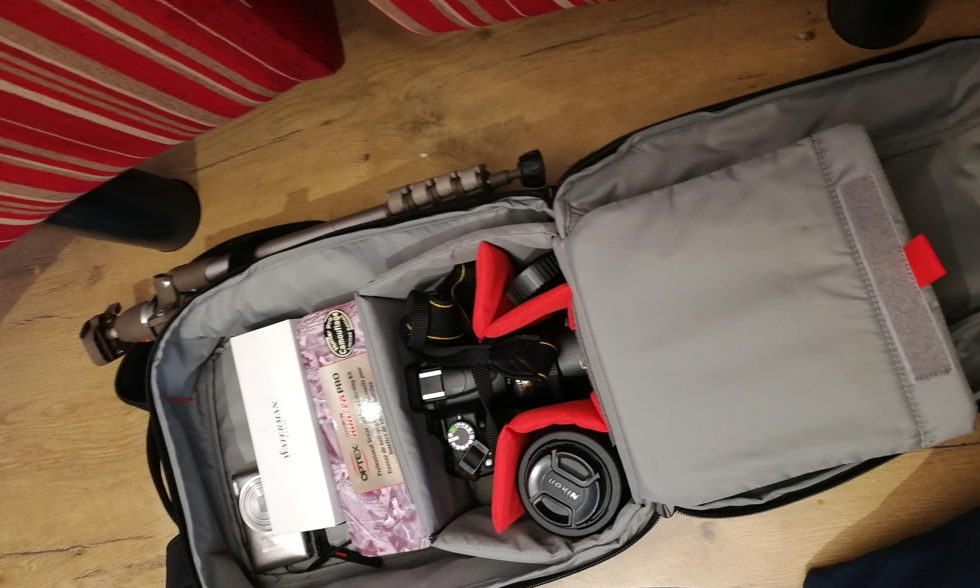 My camera kit inc Nikon D5000, 2 lenses, cleaning kit, small comact, spare SSD card, pen notebook and laptop